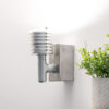 Dimmable Uplighter. Industrial Style, next to shelf with green plant